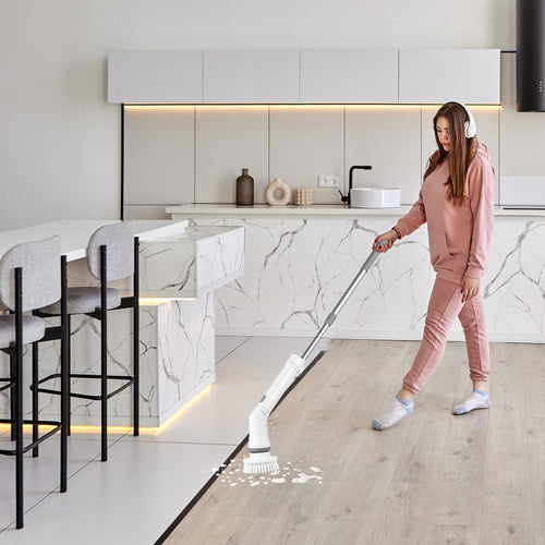 Cleaning the kitchen floor with the extended spin scrubber — no bending